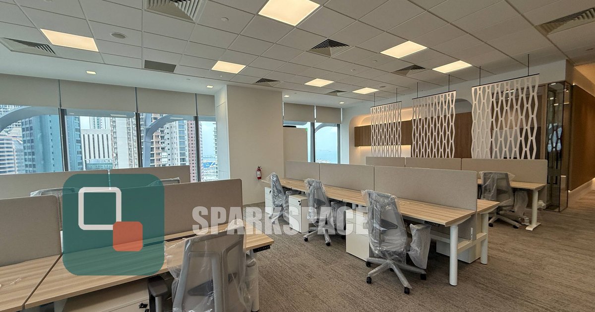 Furnished open-plan workstations with harbour views in a fitted office at Keppel South Central, Level 14