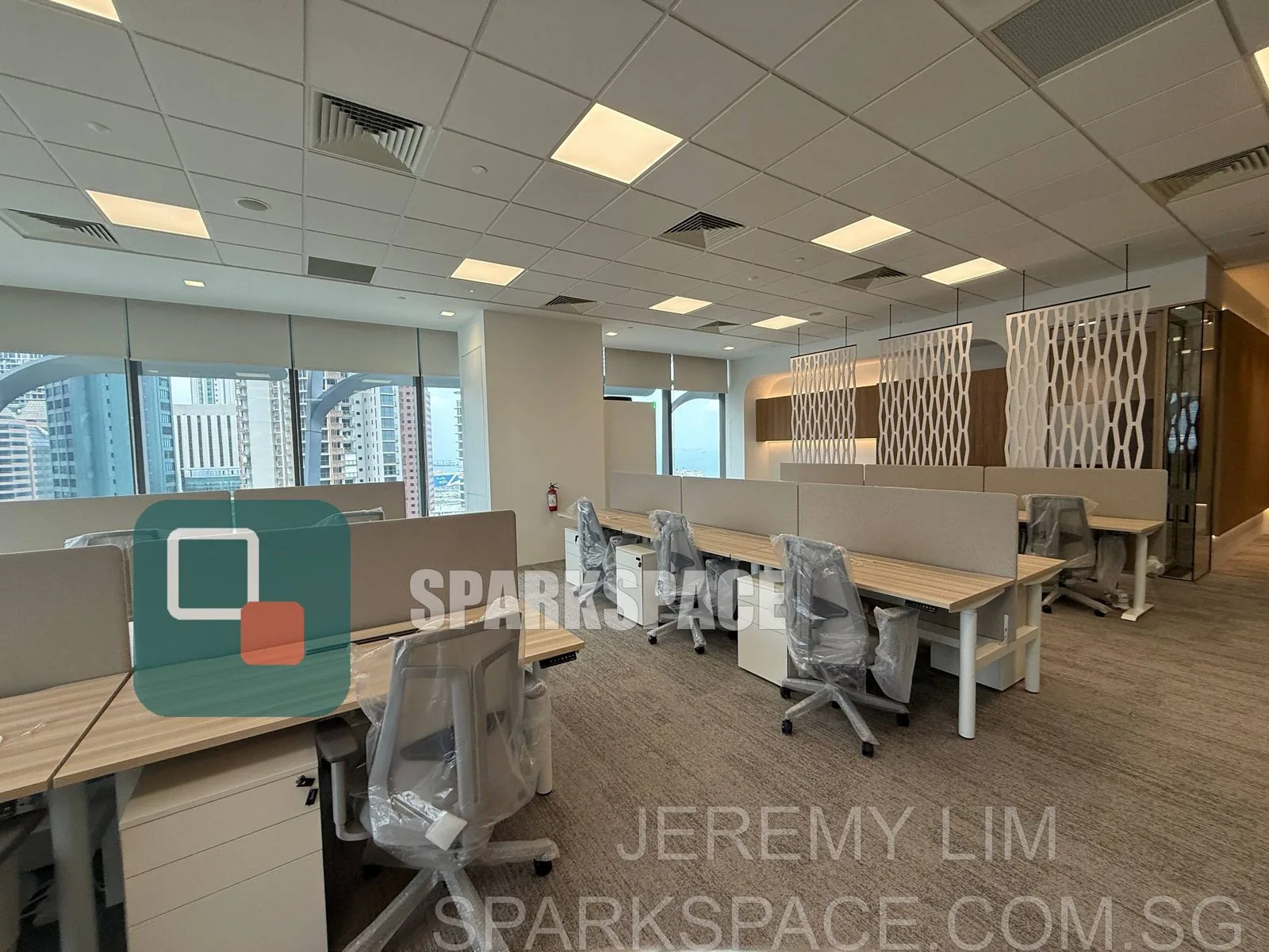 Furnished open-plan workstations with harbour views in a Keppel South Central fitted office